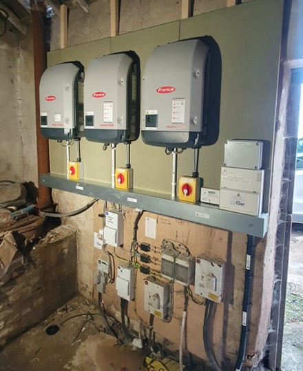 3 inverters on a wall